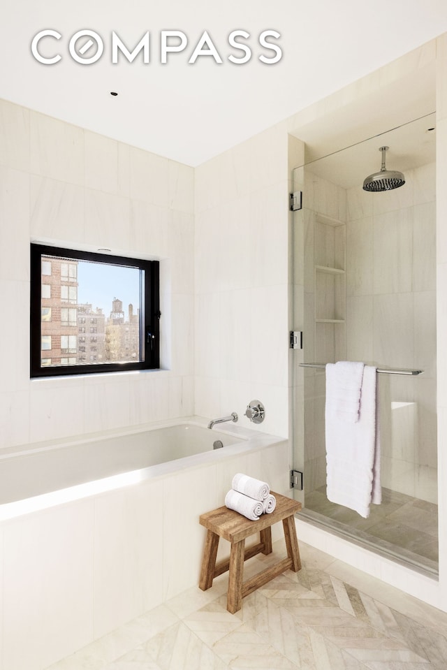250 W 96th St Unit 11E, New York City, NY 10025 - full bath with a stall shower, a bath, tile patterned flooring, and tile walls