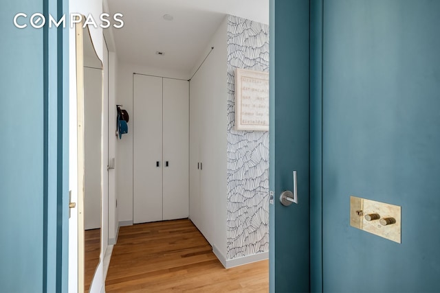 corridor featuring light wood-style floors