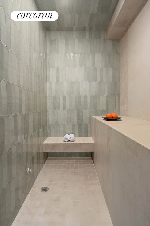 full bath featuring a tile shower