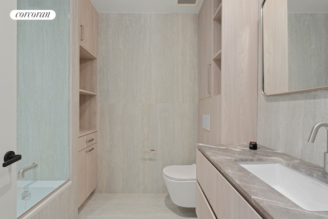 25 Conselyea St Unit 1, New York City, NY 11211 - full bath with vanity, tile walls, and shower / bathtub combination