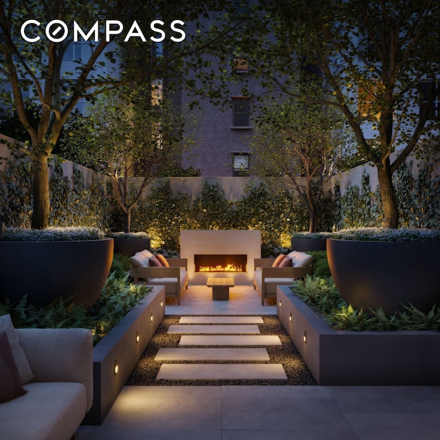 view of patio featuring an outdoor fire pit