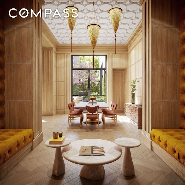community lobby featuring ornamental molding and a high ceiling
