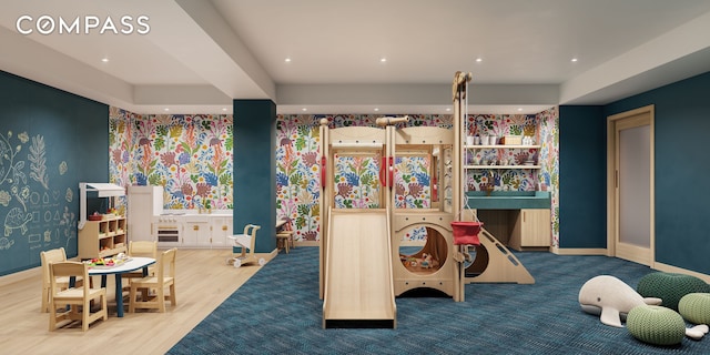 recreation room featuring wallpapered walls and baseboards