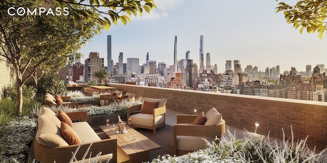 view of patio / terrace with outdoor lounge area and a view of skyline
