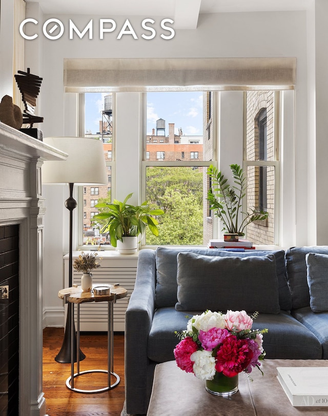 25 5th Ave Unit 8F, New York City, NY 10003 - living area featuring healthy amount of natural light and wood finished floors