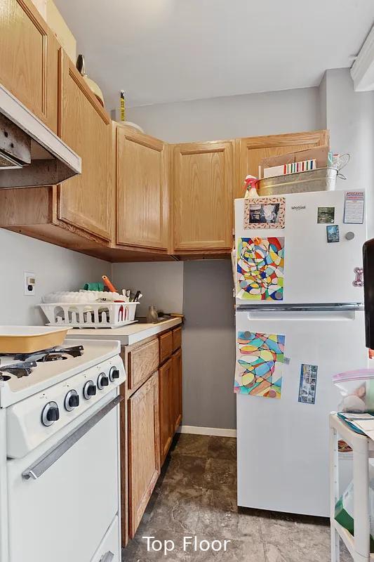 124 President St, New York City, NY 11231 - kitchen with white appliances, custom exhaust hood, light countertops, and light brown cabinets
