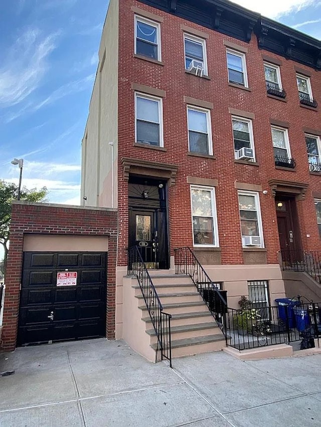 124 President St, New York City, NY 11231 - view of front of house featuring brick siding and driveway