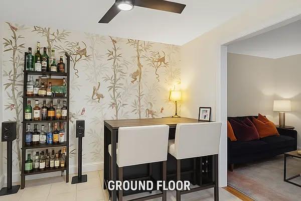 124 President St, New York City, NY 11231 - dining room featuring a dry bar, a ceiling fan, wallpapered walls, and baseboards