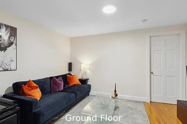 124 President St, New York City, NY 11231 - living area featuring baseboards and wood finished floors