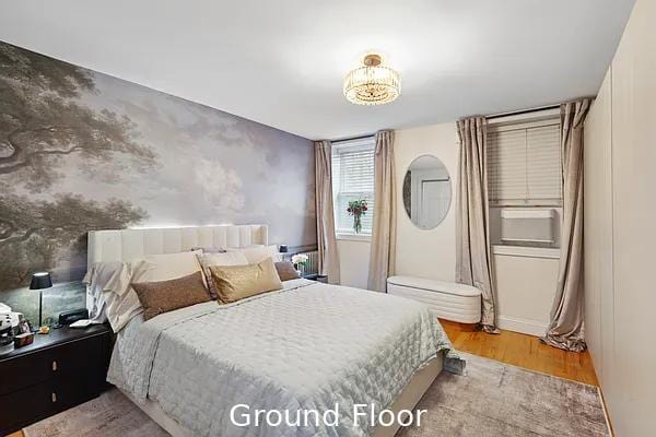 124 President St, New York City, NY 11231 - bedroom featuring wood finished floors, cooling unit, and baseboards