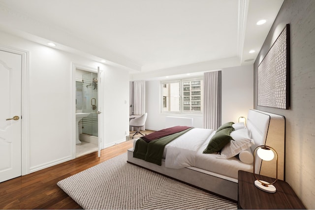 bedroom featuring wood finished floors, recessed lighting, ensuite bathroom, and baseboards