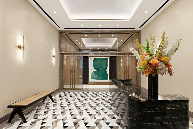 common area with recessed lighting and a decorative wall