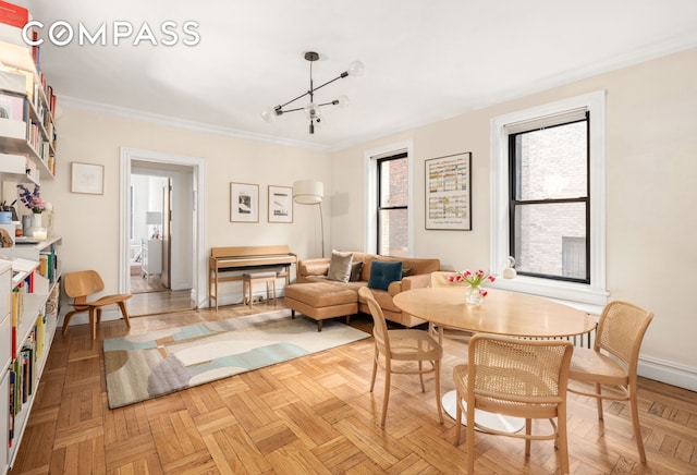 205 E 10th St Unit 3A, New York City, NY 10003 - dining area with ornamental molding, a chandelier, and baseboards