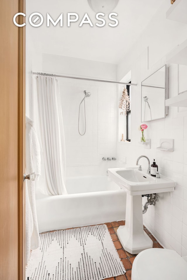 205 E 10th St Unit 3A, New York City, NY 10003 - full bath with shower / bath combo with shower curtain, toilet, and tile patterned floors