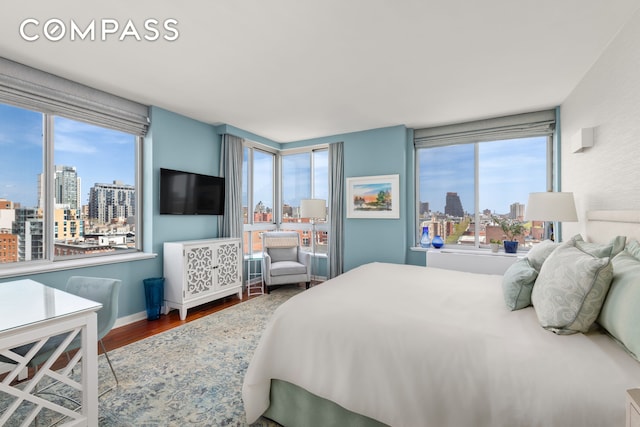 301 W 118th St Unit Ph1C, New York City, NY 10026 - bedroom featuring wood finished floors and multiple windows