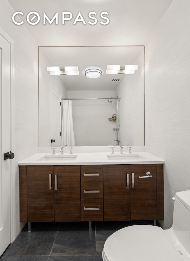 bathroom with toilet, double vanity, tile patterned flooring, and a shower with curtain