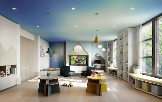living room with wood finished floors and recessed lighting