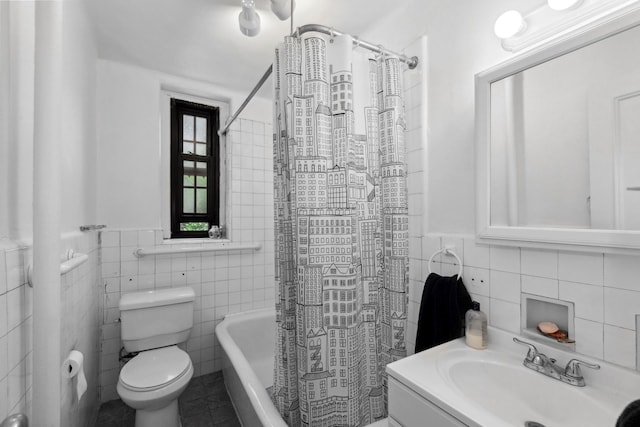 114 Clinton St Unit 3E, New York City, NY 11201 - full bathroom featuring tile walls, shower / bath combo, vanity, and tile patterned flooring
