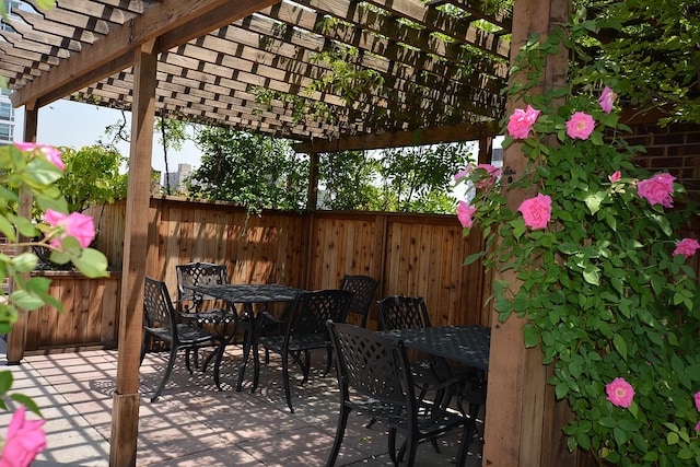 401 E 74th St Unit 2P, New York City, NY 10021 - view of patio featuring outdoor dining space and a pergola
