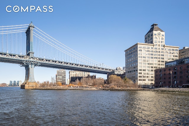 water view featuring a notable bridge and nearby urban area