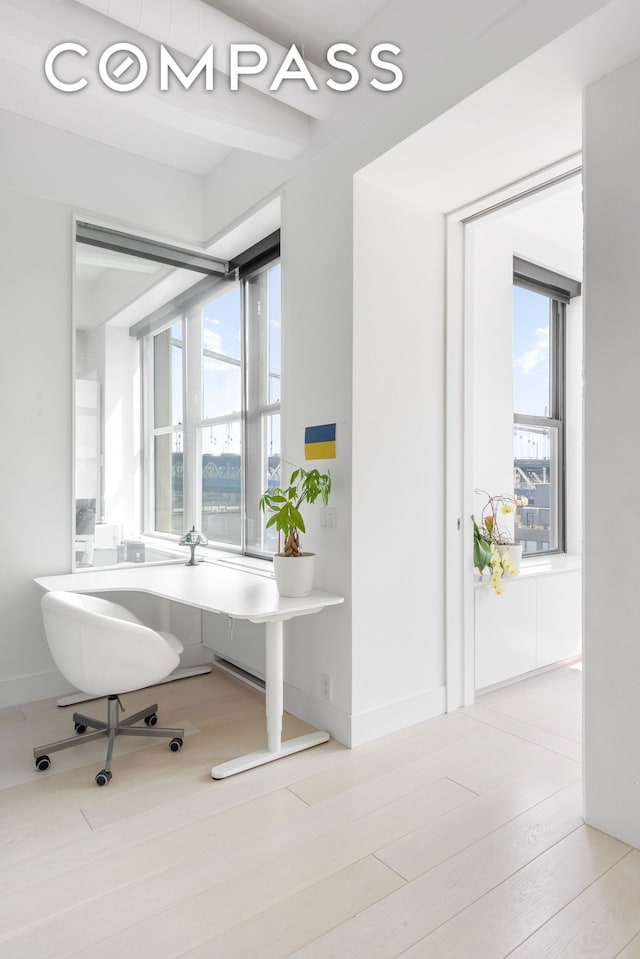 office space with wood finished floors