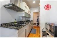 72-34 Austin St Unit F-10, New York City, NY 11375 - kitchen featuring wall chimney exhaust hood, dark countertops, and recessed lighting