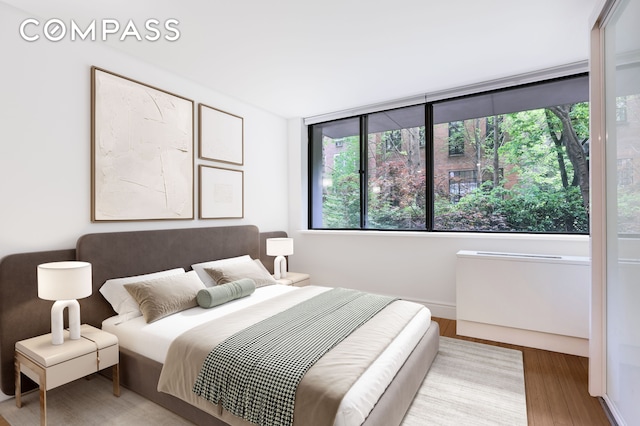 344 W 23rd St Unit 1E, New York City, NY 10011 - bedroom featuring wood finished floors