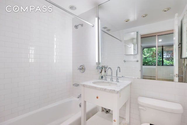 344 W 23rd St Unit 1E, New York City, NY 10011 - full bath with toilet, bathtub / shower combination, tile walls, and vanity
