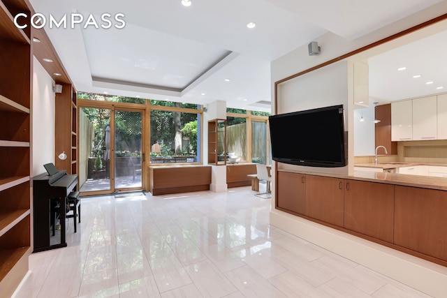 344 W 23rd St Unit 1E, New York City, NY 10011 - unfurnished living room with recessed lighting and a raised ceiling