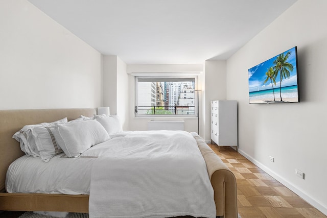 303 E 57th St Unit 6F, New York City, NY 10022 - bedroom featuring baseboards