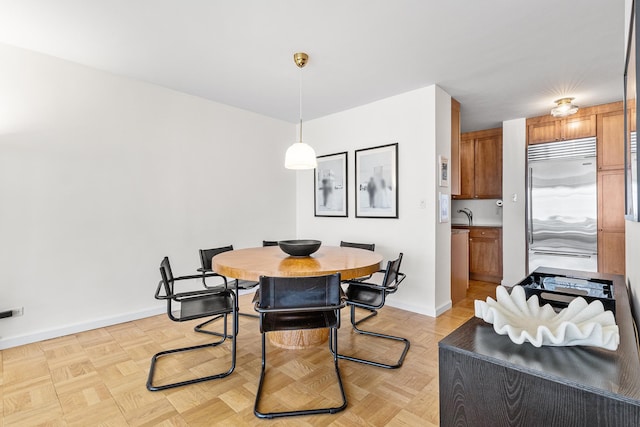 303 E 57th St Unit 6F, New York City, NY 10022 - dining space featuring baseboards