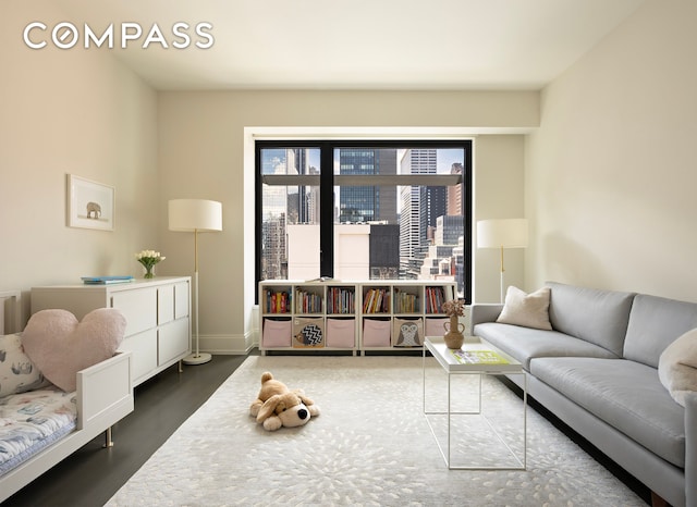 living room with dark wood-style floors and baseboards