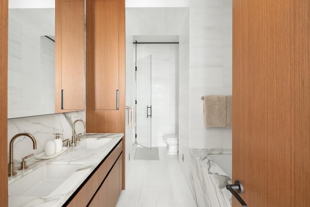 15 E 30th St Unit 21C, New York City, NY 10016 - full bath featuring a stall shower, double vanity, and toilet