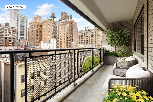 balcony featuring a city view