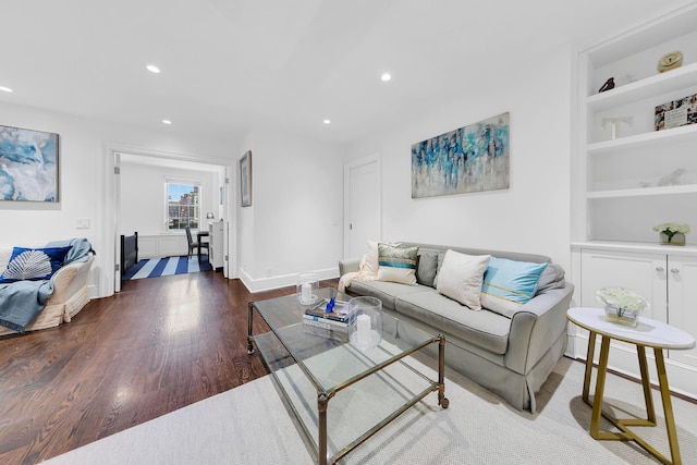 325 W 86th St Unit 7B, New York City, NY 10024 - living area with built in features, wood finished floors, recessed lighting, and baseboards