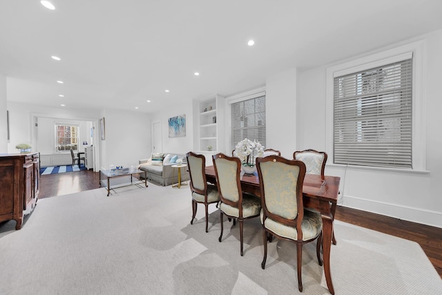 dining space with wood finished floors, recessed lighting, and baseboards