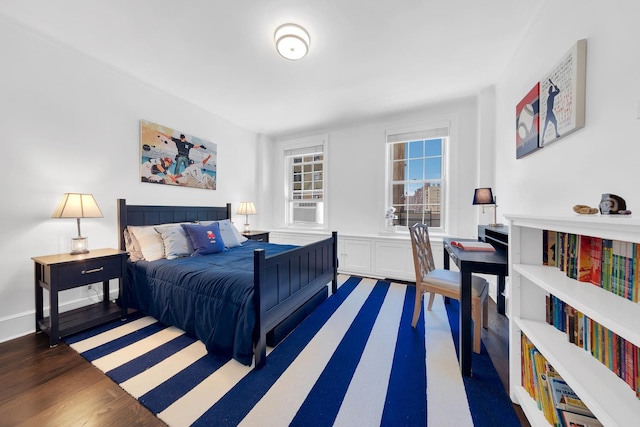bedroom with wood finished floors