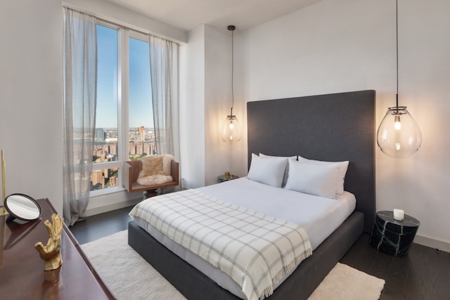 252 S St Unit 63G, New York City, NY 10002 - bedroom with wood finished floors and baseboards