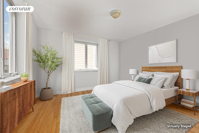 195 Bch 125th St Unit 1C, New York City, NY 11694 - bedroom with light wood-style flooring and baseboards