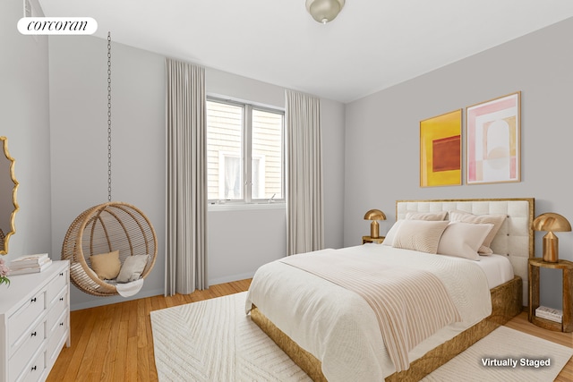 195 Bch 125th St Unit 1C, New York City, NY 11694 - bedroom with light wood-type flooring and baseboards