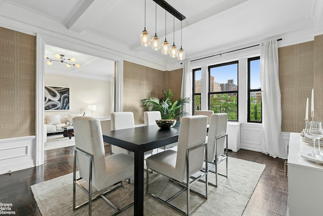 dining space with wallpapered walls, a chandelier, a wainscoted wall, crown molding, and beam ceiling