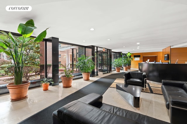 139-15 83rd Ave Unit 127, New York City, NY 11435 - building lobby featuring floor to ceiling windows and recessed lighting