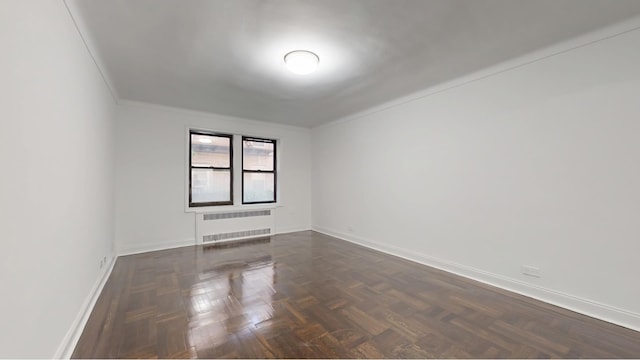 221 E 18th St Unit 1E, New York City, NY 11226 - spare room with radiator heating unit and baseboards