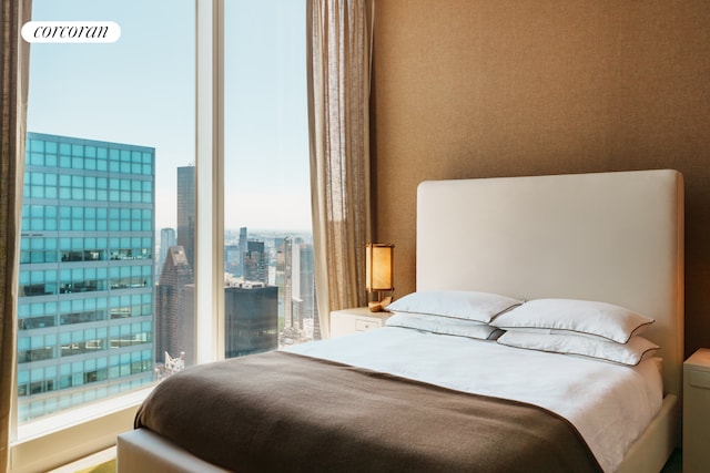 bedroom with a city view