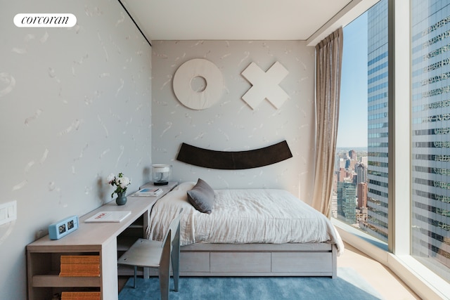 bedroom featuring a city view
