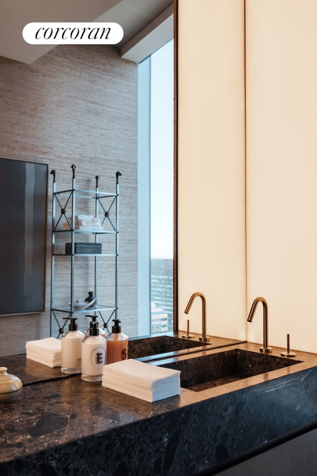 bar featuring a sink and a high ceiling