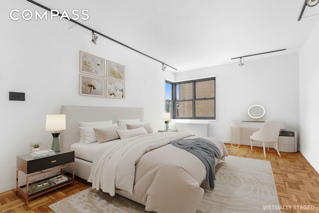 400 E 56th St Unit 38S, New York City, NY 10022 - bedroom with rail lighting