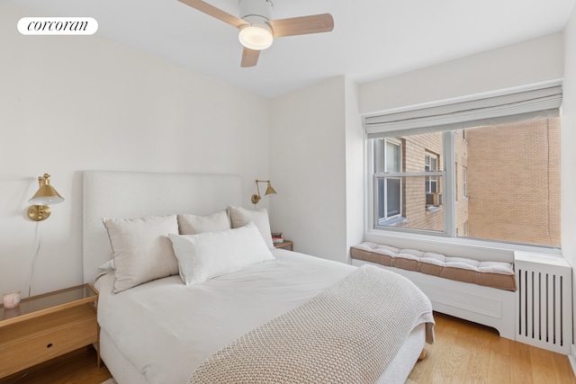 bedroom featuring wood finished floors and ceiling fan