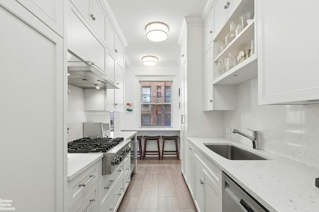 215 W 90th St Unit 6G, New York City, NY 10024 - kitchen with a sink, stainless steel appliances, white cabinetry, and crown molding