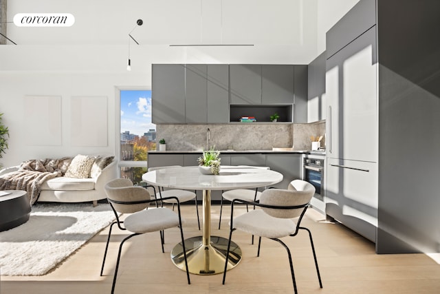 dining space with light wood-style flooring